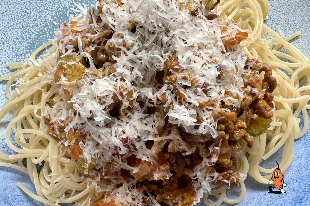 jackanapes smokin ghost hot sauce spaghetti bolognese with parmesan cheese