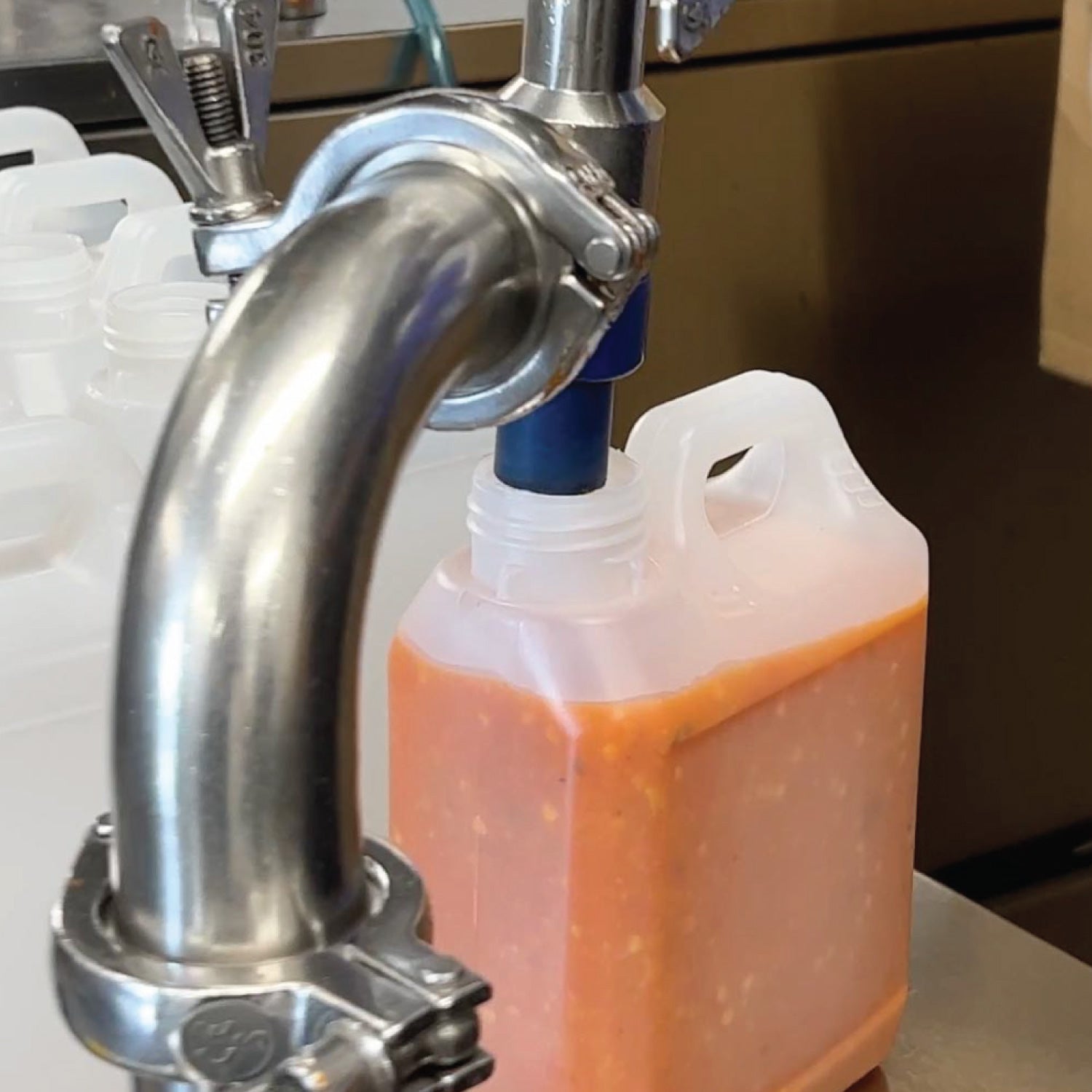 jackanapes sweet scotch bonnet hot sauce being poured into container